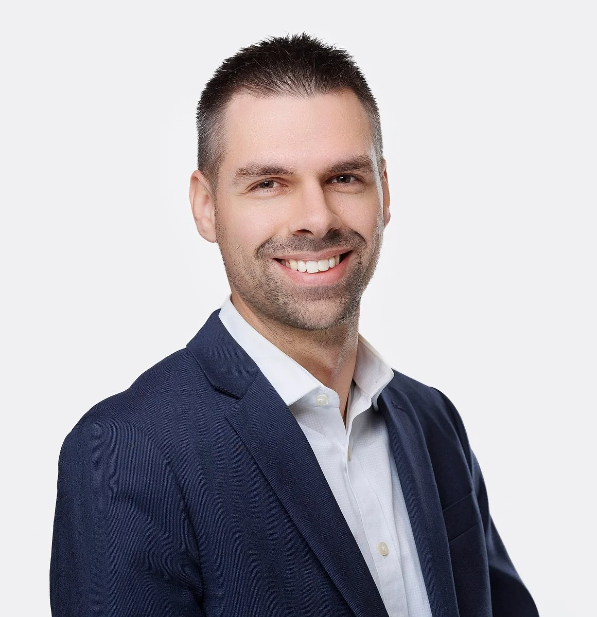 Professional headshot on a clean studio background